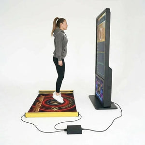 A woman jumping on the MadeForArcade jump rope arcade machine mat