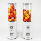 Two manual capsule dispenser towers filled with colourful capsules
