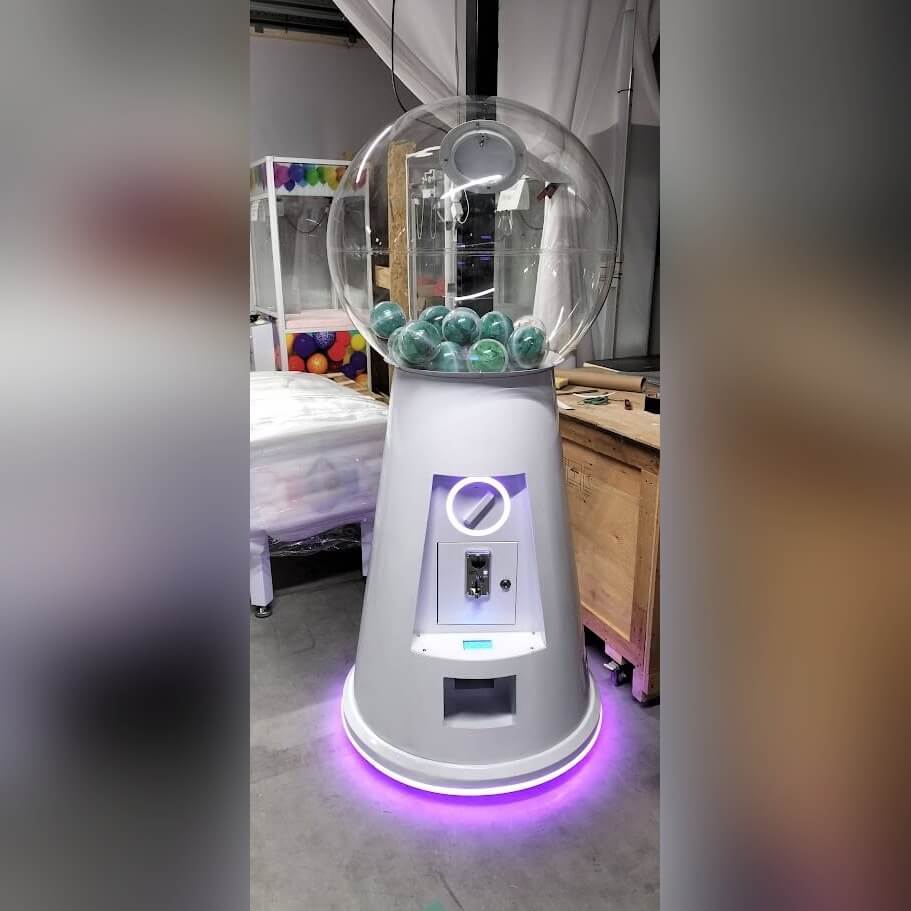 MEGA gumball machine with neon lighting in a showroom