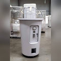 Side view of the white MadeForArcade milkshake cup capsule machine