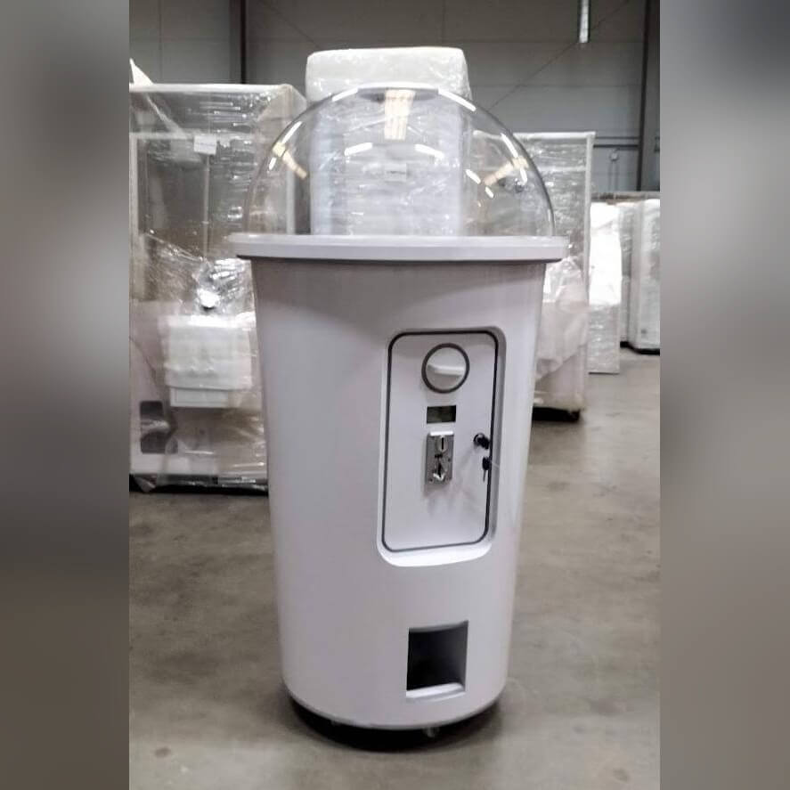 Side view of the white MadeForArcade milkshake cup capsule machine