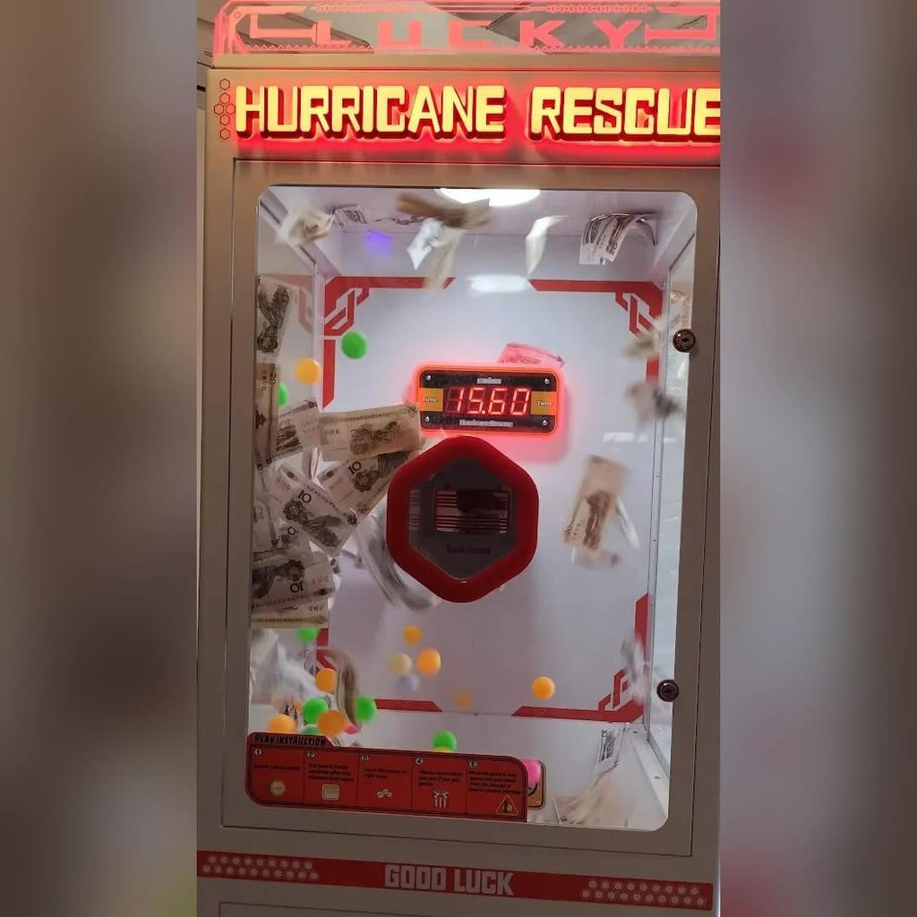 Money grabber machine with notes flying inside