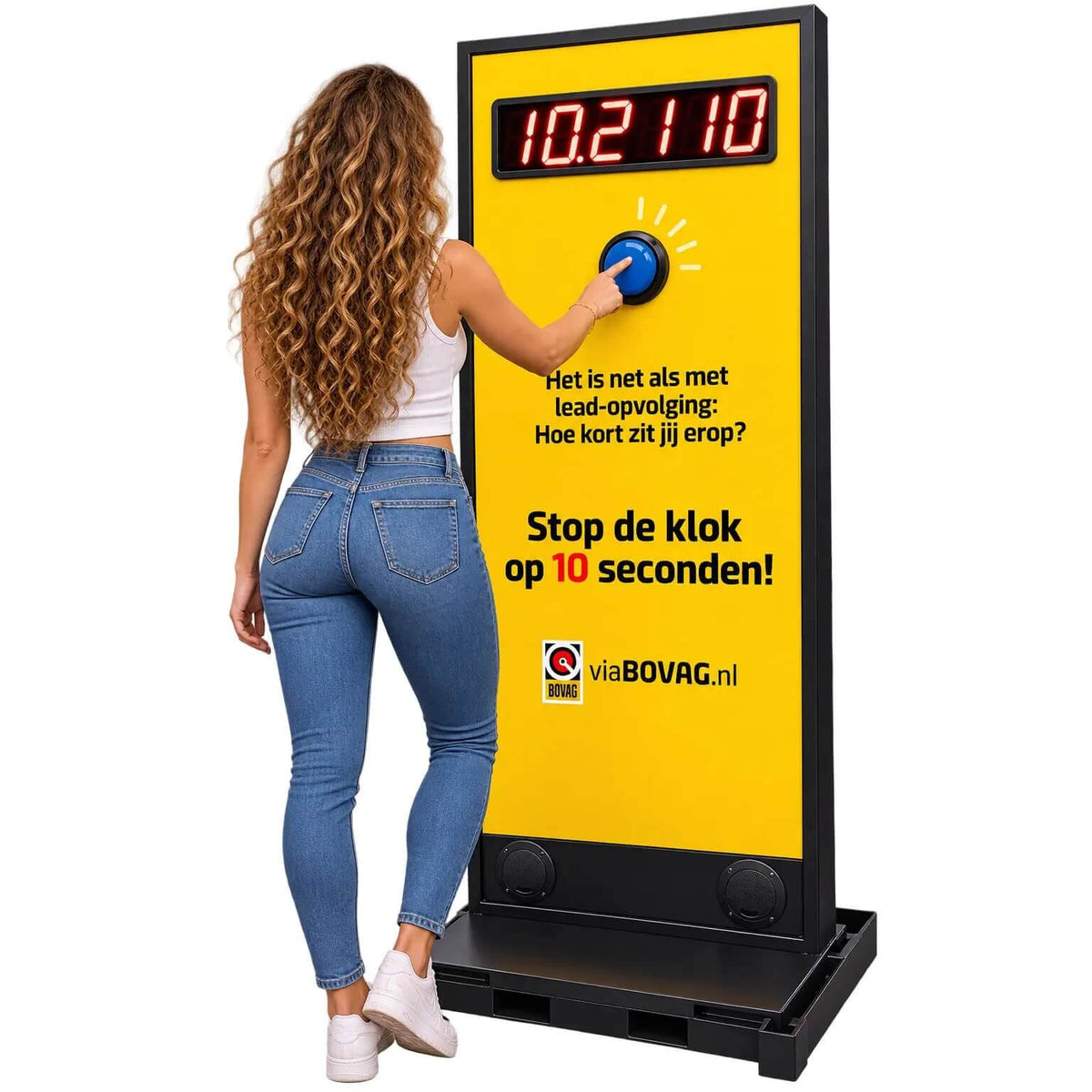 A woman pressing the button on a yellow MadeForArcade Stop the Clock totem
