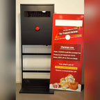 Stop the Clock totem with a red promotional panel in a shop