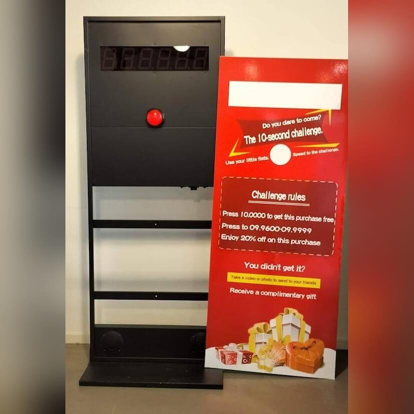 Stop the Clock totem with a red promotional panel in a shop
