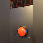 Close-up of the red button on the Stop the Clock totem