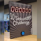 Wall-mounted 10 Sekunden Challenge game showing a zero timer