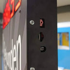 Side view of a wall-mounted Stop the Clock game