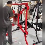 Technician assembling a small red Strike-a-Light batak machine