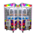 Ball and balloon claw machine filled with coloured balls