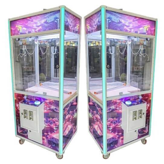 Two MadeForArcade themed claw machines with colourful artwork