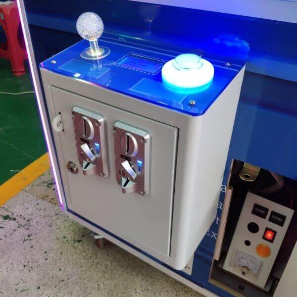 Lit control panel on the steampunk claw machine
