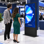 Two people at the prize wheel kiosk