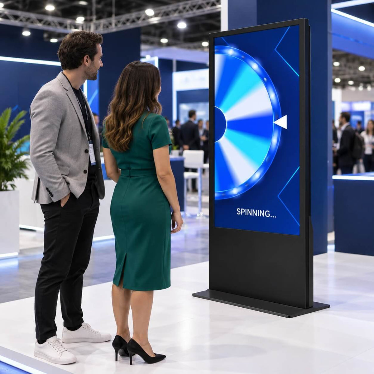 Two people at the prize wheel kiosk