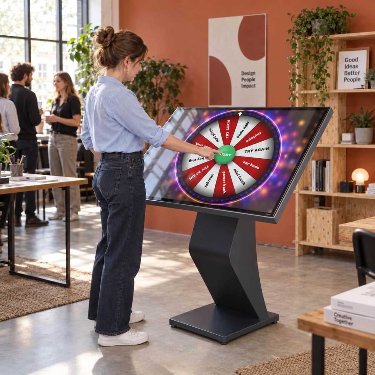 A man using the upright prize wheel kiosk