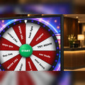 MadeForArcade touchscreen prize wheel kiosk showing a spin to win wheel
