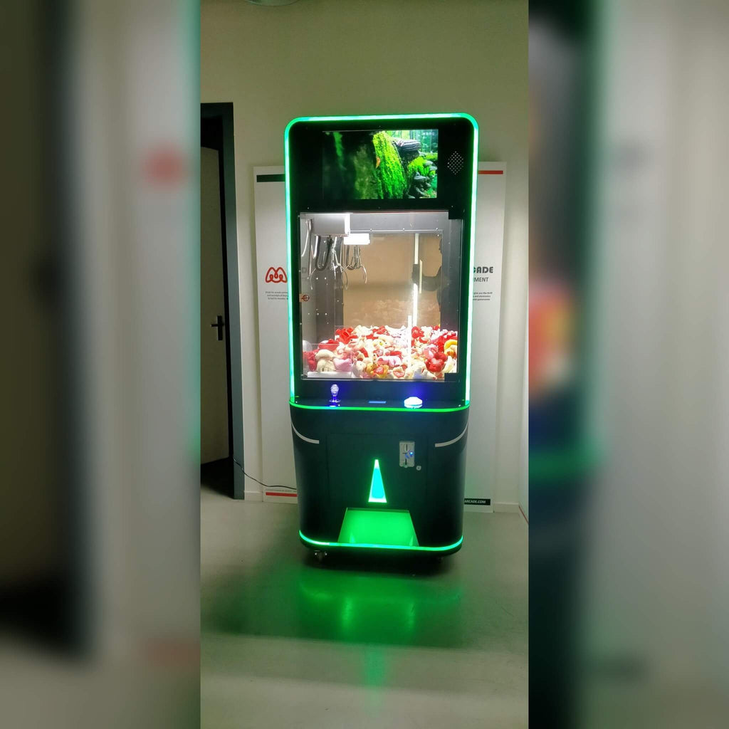 Video screen claw machine lit green
