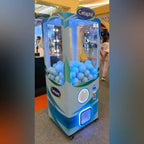 Blue XXL capsule vending tower at an event