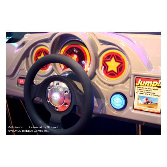 Mario Kart Arcade GP DX steering wheel and dashboard close up