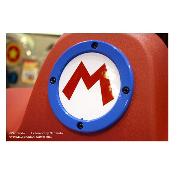 Mario Kart Arcade GP DX seat with Mario logo close up