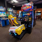 Overtake DX arcade machine glowing in a family entertainment centre