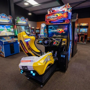 Overtake DX arcade machine glowing in a family entertainment centre