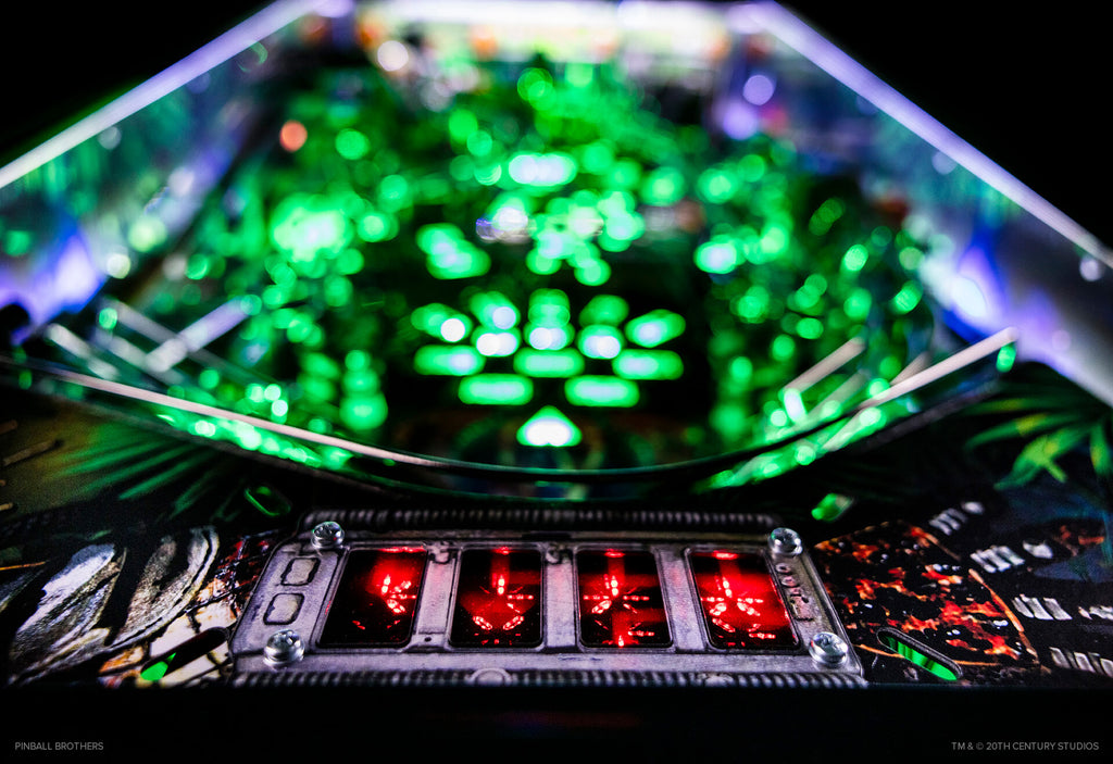 Predator Pinball Machine by Pinball Brothers - illuminated Yautja apron display
