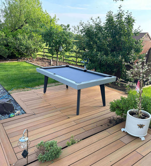 Pureline California outdoor pool table on a garden decking area