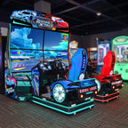 Racing XTreme DX arcade machine glowing in a family entertainment centre