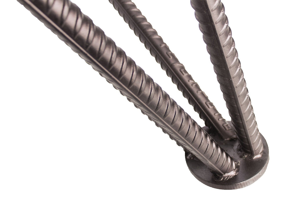 Detail of the grey-stained oak grain and steel leg on the Rasson Dauphine