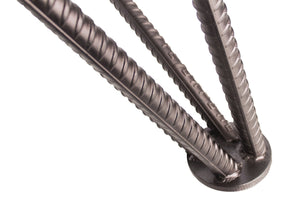Detail of the grey-stained oak grain and steel leg on the Rasson Dauphine