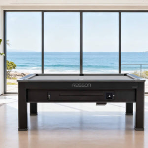 Rasson Ironman pool table in a bright living room with sea views
