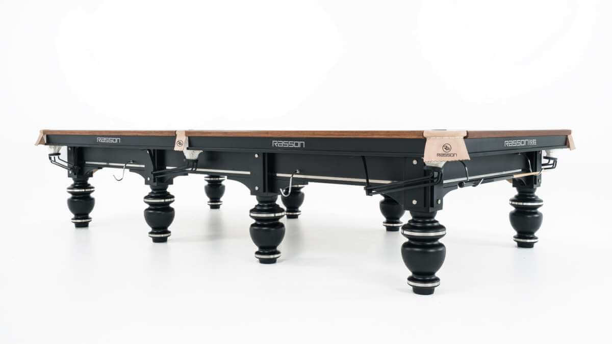 Rasson Strong II 12ft snooker table at an angle, showing the pocket plates and black leg frame