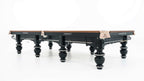 Rasson Strong II 12ft snooker table at an angle, showing the pocket plates and black leg frame