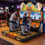 A parent and child racing on Rush and Catch at a bowling alley in the evening