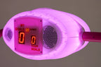Close-up of the pink illuminated overhead scorer on the Hello Kitty Baby Evo