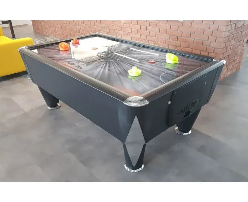 SAM Black Ice II air hockey table in a games room with a brick wall