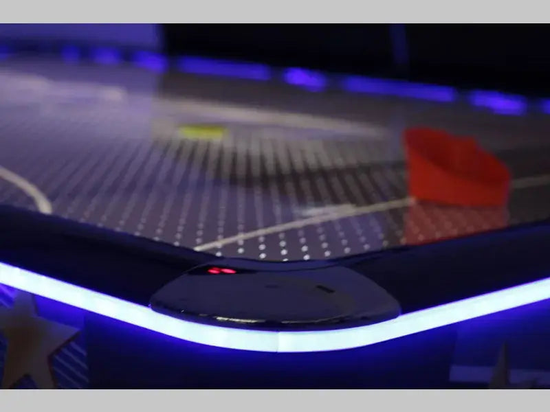 Close-up of the SAM Double Evo top rail lit in blue with a red bat