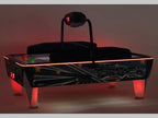 SAM Double Evo air hockey table glowing with red LED lighting