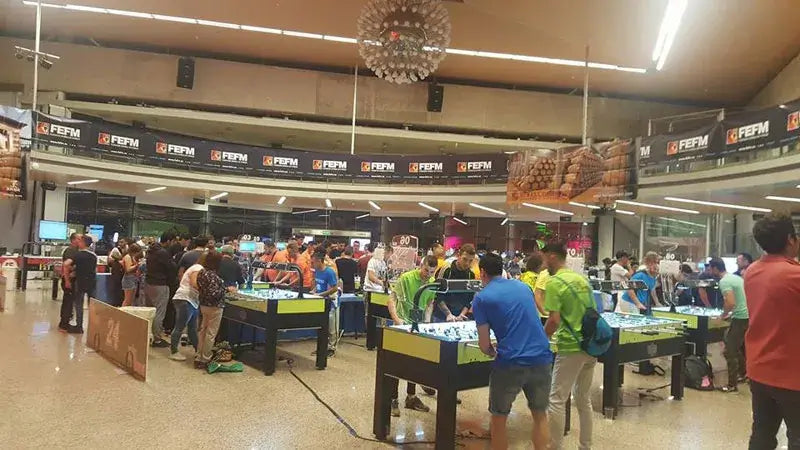 Rows of SAM Tecno Professional football tables at a tournament