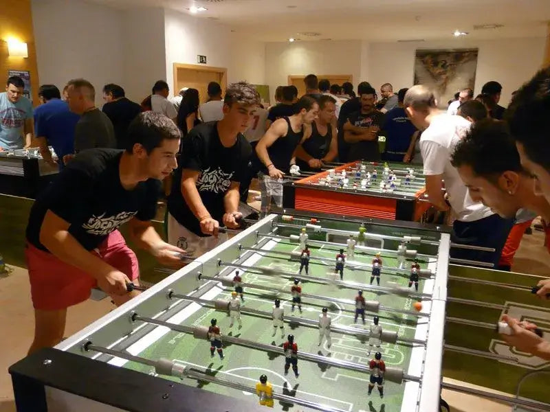 Players at a SAM Tecno Professional football table tournament