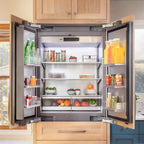 Signature Kitchen Suite French door fridge freezer with both doors open in a wooden kitchen, filled with fresh food and drinks