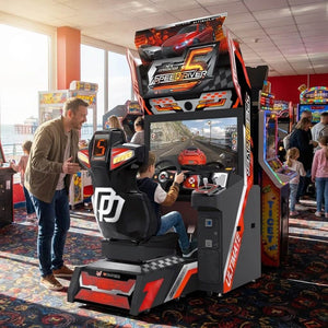 Speed Driver 5 racing arcade machine in a UK seaside arcade with a child racing