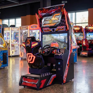 Speed Driver 5 arcade machine glowing in a family entertainment centre