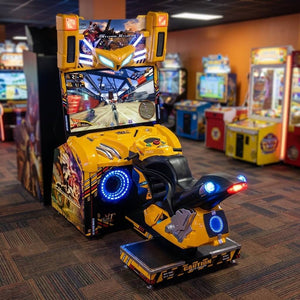 Storm Rider arcade machine glowing in a family entertainment centre