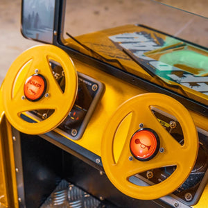 Yellow steering wheel and horn on the WIK Jeep Off-Road kiddie ride