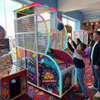 WIK Nova basketball arcade machine in a UK seaside arcade with a child playing