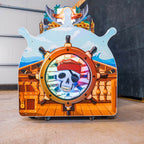 Ship's wheel and pirate skull on the back of the WIK Pirate Island arcade machine