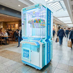 WIK Space Drop prize machine in a shopping centre walkway next to a cafe