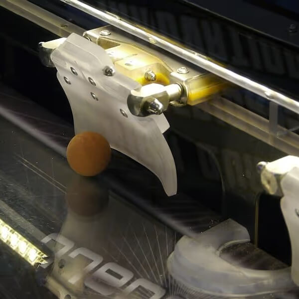 Ball and puncher inside the WIK Speedball table